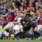Chelsea's Frank Lampard shoots to score watched by Aston Villa's Nathan Baker (L) during their...