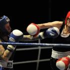 Cherine Henry (Dunedin) misses with a right during her bout with Michelle Blackie (Invercargill)...
