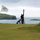 Chisholm Park golf professional Andrew Whiley, of Dunedin, uses a 2.7m-high roll of shade cloth...