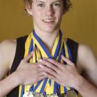 Chris Dickie with the 15 individual gold medals he won at the Otago swimming championships at...