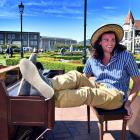 Chris Hamblin, of Boston, Massachusetts, busks and basks in the sunshine outside the Dunedin...