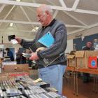 Chris Pike  sifts  through tapes in search of a gem at the Dunedin Host Lions Club music and...