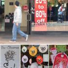 Christmas sale signs in Dunedin shop windows yesterday. Photo by Craig Baxter.