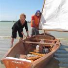 Christy and Ken Rolfe, of Oamaru, prepare their boat for the Oamaru Harbour Regatta rowing and...