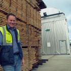 City Forests Ltd wood-processing manager John Speirs stands outside a new drying kiln which was...