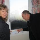 Clare Curran and Phil Twyford take a closer look at  mould on windows in Karyn and Graeme...