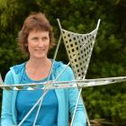 Clutha district councillor Hillary McNab inspects the model of Russell Beck's waka sculpture  the...