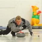 Colby Oracheski plays for the Dave Thomas team at the Maniototo Curling Rink in Naseby yesterday....