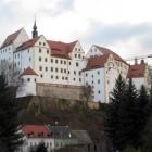 Colditz Castle dominates the sky above the local village. 
...