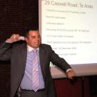 Colliers International national auction manager John Bowring appeals to investors at the Dunedin...