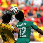 Colombia's Abel Aguilar (L) jumps for the ball with Ivory Coast's Wilfried Bony. REUTERS/Paul Hanna