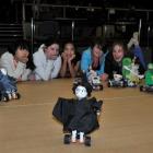 Columba College pupils line up to watch Molly Inman (13) put her "Harry Potter" robot through its...