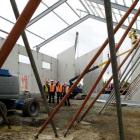 Work proceeds on the East Otago community sports and cultural centre as (from left) site foreman...