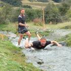 Competitors in The Mule, an assault-style obstacle course race held at Moke Lake at the weekend,...