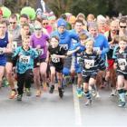 Competitors race away at the start of the Golden Mile at the Queenstown Winter Festival on...