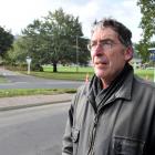 Concerned resident Paul Sorrell at the site of Tuesday's truck crash at the bottom of Pine Hill...