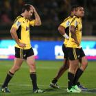 Conrad Smith (left) and Tusi Pisi of the Hurricanes look on in disappointment after the during...