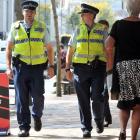 Constable Ben West (left) and Constable Jo Ammundsen walk along George St yesterday afternoon....