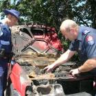 Constable Bruce McLean, of Wanaka, and fire safety officer Stu Ide, of Queenstown, inspect a...