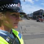 Constable Emily Plew surveys the five-way intersection on George St. Photo by Jonathan Chilton...