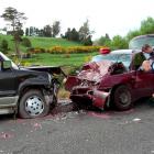 Constable Logan Dickie, of Balclutha, marks out the scene of yesterday's fatal collision near...