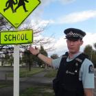 Constable Nayland Smith points out why speeding motorists have concerned Omarama residents. Photo...