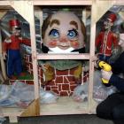 Contract museum technician John McGann adds the finishing touches to a storage crate containing a...