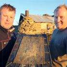 Contractor Gus Gordon (left) and farmer Ben Falconer display some of the proceeds from their gold...