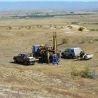 Contractors for Glass Earth Gold drill one of 65 test holes at its McAdie prospect in the Ida...