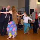 Labour ministers David Benson-Pope (left) and Pete Hodgson dance with the locals during the Cook...