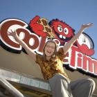 Cookie Time franchisee Verity Richard celebrates as the sign goes up on the new Queenstown store,...