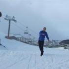 Coronet Peak's ski area manager, Ross Copland, throws snowballs  as opening day looms. Photo by...