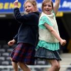 Cousins Lily and Lucy Woodhouse (both 9) dance on the pitch at the sound check. Photos by Peter...