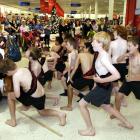 Cr Lee Vandervis (rear, second from left) watches pupils from the Waikouaiti Primary School kapa...