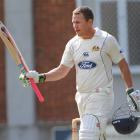 Craig Cumming celebrates yet another century for Otago. Photo from <i>ODT</i> files.