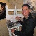 Craig Primrose, at work on his latest painting, Lake Hayes, at Artbay Gallery, in Queenstown...