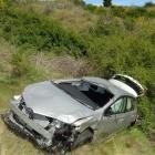 This rental car, driven by an Australian man, crashed down a steep bank below the Gibbston...