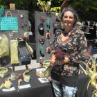 Creative Queenstown Art and Crafts Market manager Jasmine Clark holds a bouquet at her flax and...