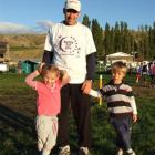 Cromwell athlete Terry Davis takes a break with his children Tori (3) and Matthew (4) during the...
