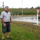 Cromwell Community Board chairman Neil Gillespie yesterday watches traffic at the intersection...