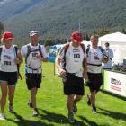 Crossing the finish line in third place in the Cure Kids Great Adventure Race on Saturday is the...