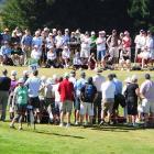Crowds gather to watch the leaders at the New Zealand Open at The Hills course in Arrowtown today...
