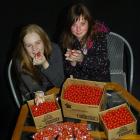Cure Kids' ambassadors Moneka Prasad-St Clair and Izzy Kloogh try hard to resist the sweet...