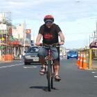 Cyclist Paul Hansen rides along a quiet King Edward St in South Dunedin, yesterday afternoon....