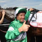 Damien Oliver celebrates winning the AAMI Victoria Derby riding Fiveandahalfstar during Victorian...