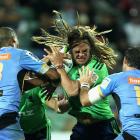 Dan Pryor of the Highlanders is caught by the Force defence. Photo Getty