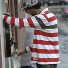 Dan Roberts fills his bottles  from the Speight's Brewery water tap yesterday. Photo by Linda...