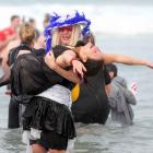 Daniel Bell (left) attempts to save Jodi-Lee Williams from the frigid waters of St Clair beach.