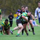 Daniel Johnson tackles Green Island prop Simon McCarthy.