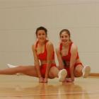 Danielle Galdeman (15, left) and Georgia Henderson (16) demonstrate a straddle which helped them...